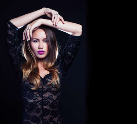 beauty rich woman with bright makeup wearing luxury jewellery on black background, fashion ladyの写真素材