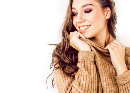 young pretty teenage hipster girl posing emotional happy smiling on white background, lifestyle people conceptの写真素材