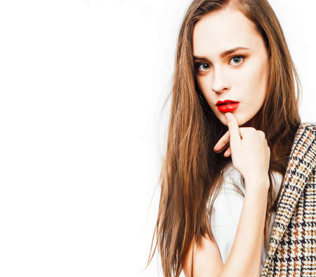 young pretty woman with brunette hair on white background isolated, sensual makeup, fashion look, lifestyle people conceptの写真素材