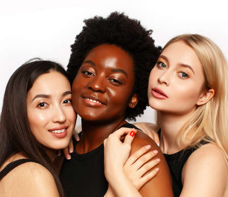 different nation woman: african-american, caucasian, asian together isolated on white background happy smiling, diverse type on skin, lifestyle people conceptの写真素材