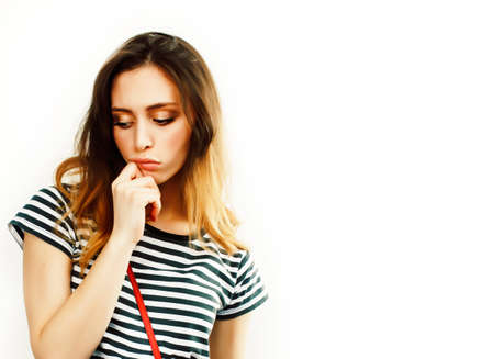 young pretty teenage hipster girl posing emotional happy smiling on white background, lifestyle people conceptの写真素材