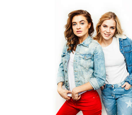 best friends teenage girls together having fun, posing emotional on white background, besties happy smiling, lifestyle people conceptの写真素材
