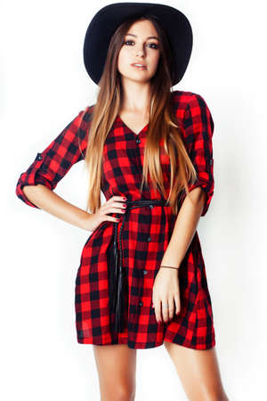 young pretty brunette girl hipster in hat on white background casual close up dreaming smilingの写真素材