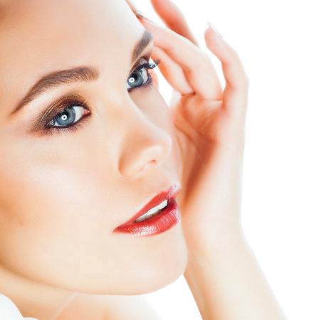 young pretty woman with big white flower close up isolated on white, hands manicure, spa people conceptの写真素材