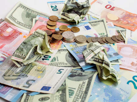 Cash on table isolated: dollars, euro, rubl broken money. All in mess, global crisis concept, dollar rules worldの写真素材