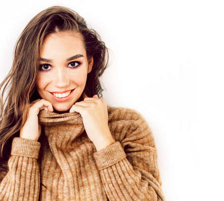young pretty teenage hipster girl posing emotional happy smiling on white background, lifestyle people conceptの写真素材