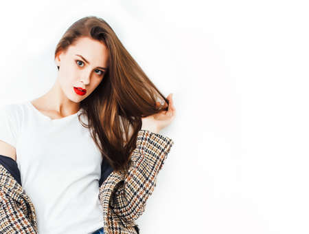 young pretty woman with brunette hair on white background isolated, sensual makeup, fashion look, lifestyle people conceptの写真素材