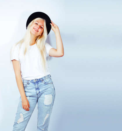 young pretty stylish blond hipster girl in hat posing emotional isolated on white background, lifestyle people conceptの写真素材