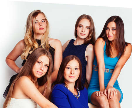 group of many cool modern girls friends in bright clothers together having fun isolated on white background, happy smiling lifestyle people conceptの写真素材