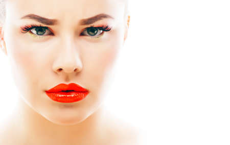 young blond real woman with bright make up smiling pointing gesturing emotional isolated like doll lashesの写真素材