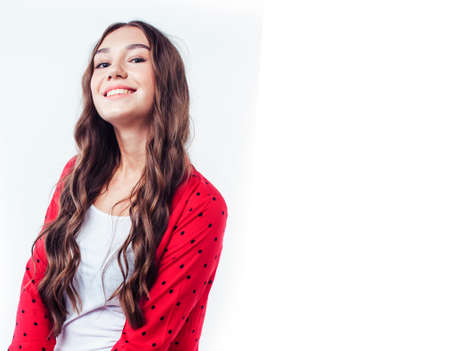 young pretty brunette real girl hipster on white background casual close up dreaming isolated smiling close upの写真素材