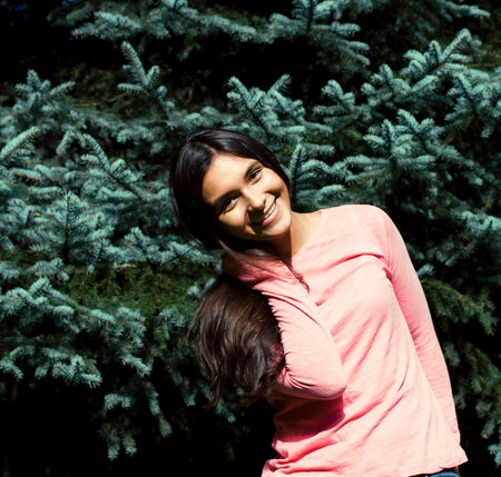 Young cute smiling real stylish dressed woman in green palm park smiling, resting, enjoing, lifestyle outside conceptの写真素材
