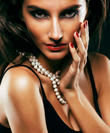 beauty rich woman with bright makeup wearing luxury jewellery on black background, fashion ladyの写真素材