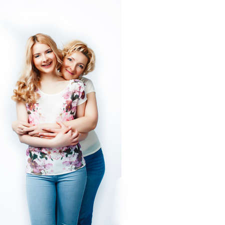 mother with daughter together posing happy smiling isolated on white background with copyspace, lifestyle people conceptの写真素材