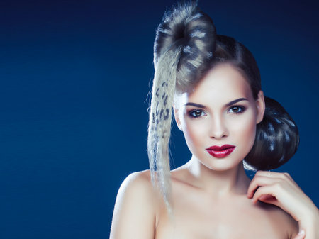 young elegant woman with creative hair style leopard print close up halloween stylishの写真素材