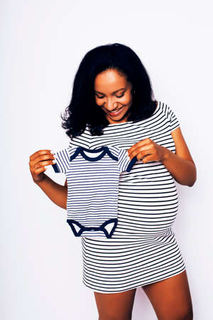 young pretty african american woman pregnant happy smiling, posing on white background isolated , lifestyle people concept copyspace close upの写真素材