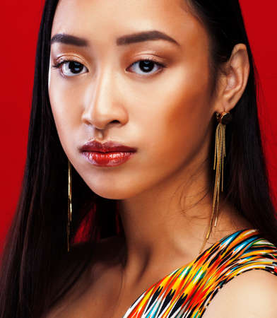 beauty young asian girl with fashion make up on red background , beauty stylish lookの写真素材