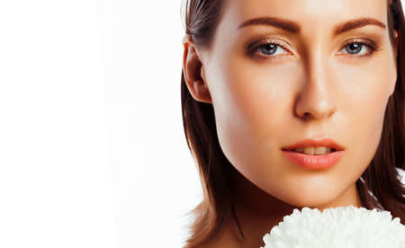 young pretty woman with big white flower close up isolated on white, hands manicure, spa people conceptの写真素材