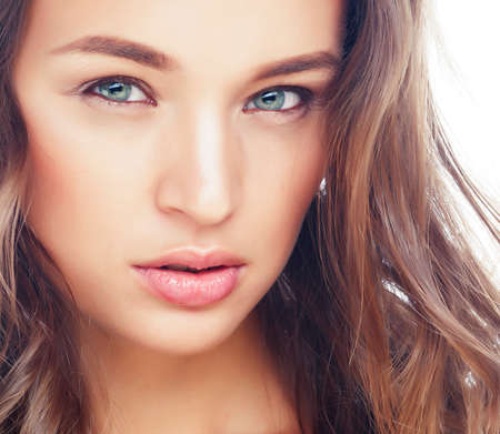 young sweet brunette woman close up isolated on white background, perfect pure innocense beautifulの写真素材