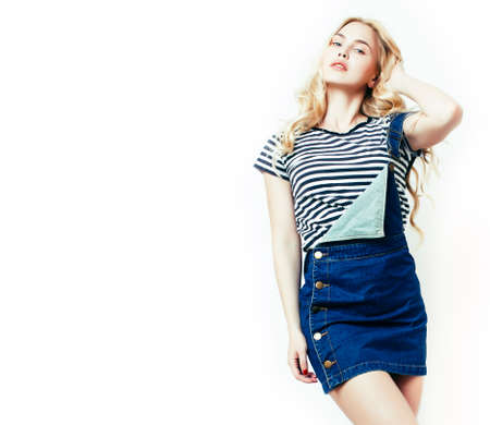 young pretty teenage hipster girl posing emotional happy smiling on white background, lifestyle people concept closeupの写真素材