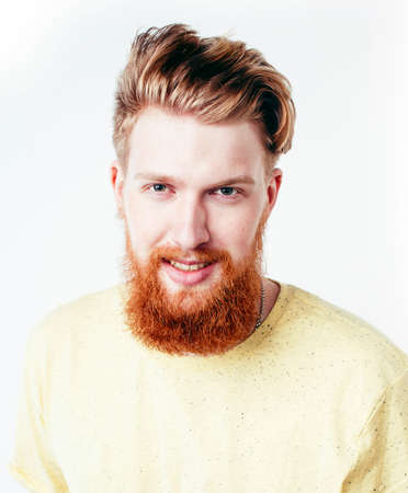 young handsome hipster ginger bearded guy looking brutal isolated on white background, lifestyle people conceptの写真素材