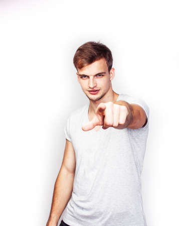 young handsome teenage hipster guy posing emotional, happy smiling against white background isolated, lifestyle people conceptの写真素材