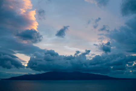 beautiful landscape on sea with sunset, dramatic clouds with red fireの写真素材