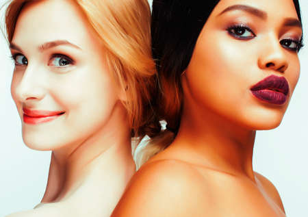 different nation woman: african-american and caucasian together isolated on white background happy smiling, diverse type on skin, lifestyle people conceptの写真素材