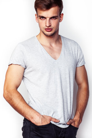 young handsome teenage hipster guy posing emotional, happy smiling against white background isolated, lifestyle people conceptの写真素材