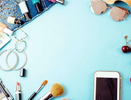 diverse travel girlish stuff on colorful background blue and yellow, nobody tourism lifestyle concept close upの写真素材