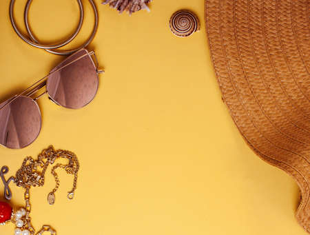diverse travel girlish stuff on colorful background blue and yellow, nobody tourism lifestyle concept close upの写真素材