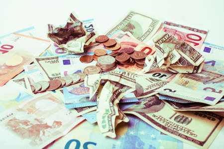 Cash on table isolated: dollars, euro, rubl broken money. All in mess, global crisis concept, dollar rules worldの写真素材