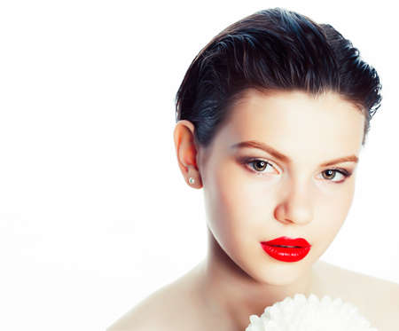 young brunette woman close up isolated on white background with flower, spa healthcare people conceptの写真素材