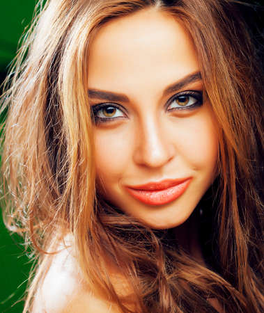 young cute blonde woman on green palm background smiling happy, lifestyle peole conceptの写真素材