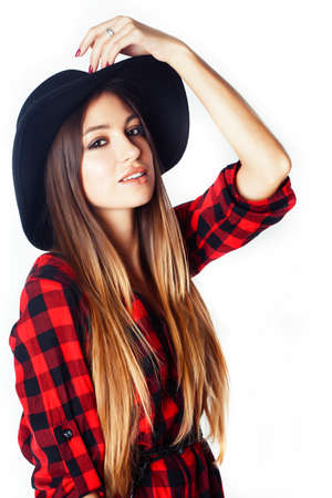 young pretty brunette girl hipster in hat on white background casual close up dreaming smilingの写真素材