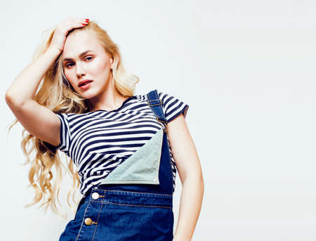 young pretty teenage hipster girl posing emotional happy smiling on white background, lifestyle people concept closeupの写真素材