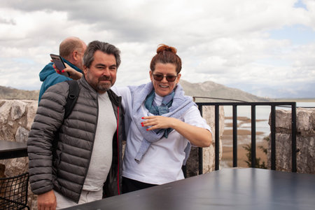 senior friends tourists outdoor adventure together on mediterranian seaの写真素材