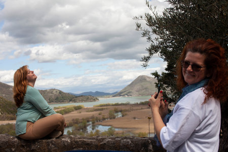 senior friends tourists outdoor adventure together on mediterranian seaの写真素材