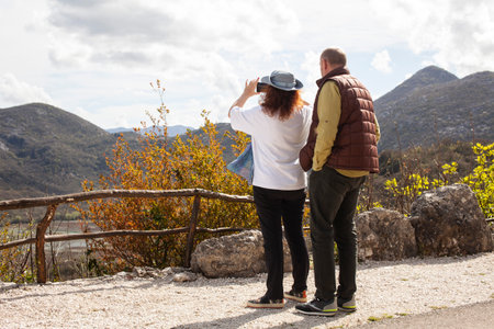 senior friends tourists outdoor adventure together on mediterranian seaの写真素材