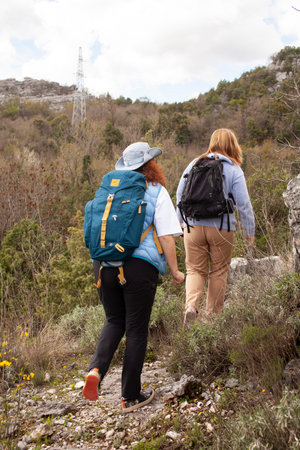 senior friends tourists outdoor adventure together on mediterranian seaの写真素材