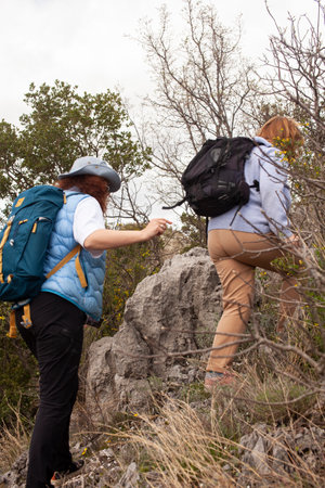 senior friends tourists outdoor adventure together on mediterranian seaの写真素材