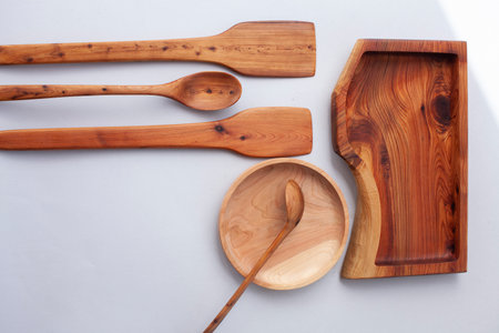 Wooden kitchen utensils stacked view, spoon and spatulaの写真素材