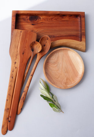Wooden kitchen utensils stacked view, spoon and spatulaの写真素材