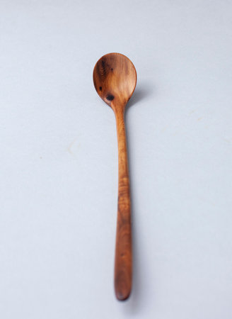 Wooden kitchen utensils stacked view, spoon and spatulaの写真素材