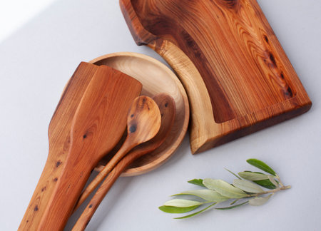 Wooden kitchen utensils stacked view, spoon and spatulaの写真素材