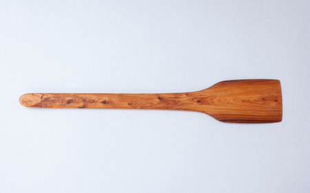 Wooden kitchen utensils stacked view, spoon and spatulaの写真素材