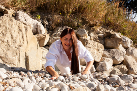 young brunette girl having fun on seacoast, lifestyle people conceptの写真素材