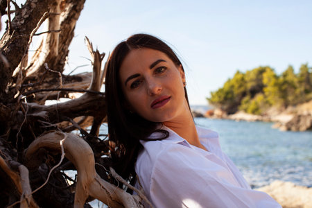 young brunette girl having fun on seacoast, lifestyle people conceptの写真素材