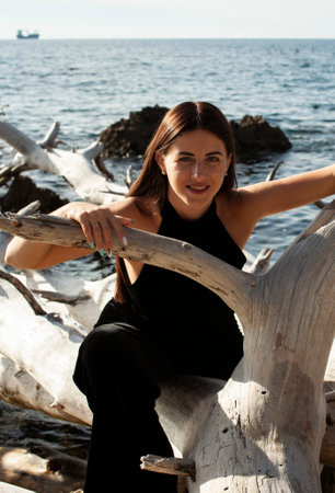 young brunette girl having fun on seacoast, lifestyle people conceptの写真素材