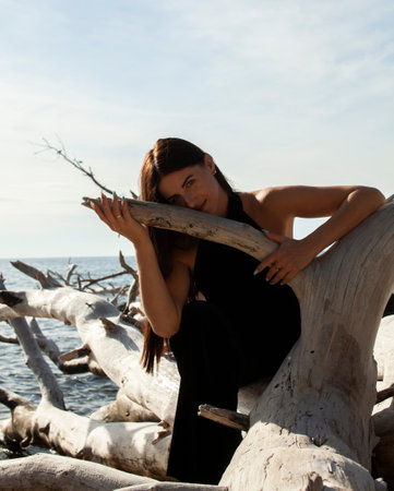 young brunette girl having fun on seacoast, lifestyle people conceptの写真素材